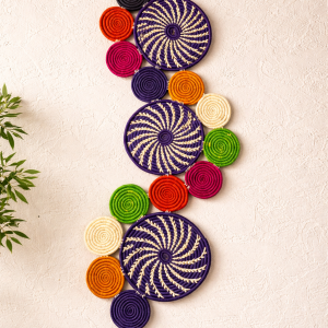 Handwoven African wall basket decor set arranged in colorful spiral patterns