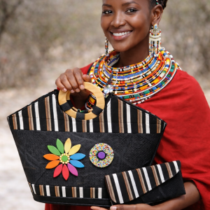 Maasai beaded handbag and wallet set worn by African model in traditional attire