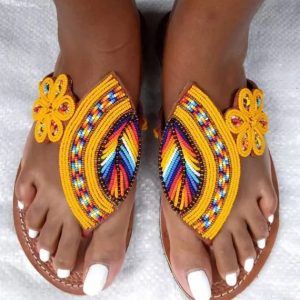 Yellow African beaded leather sandals with multicolor beadwork and floral ankle detail